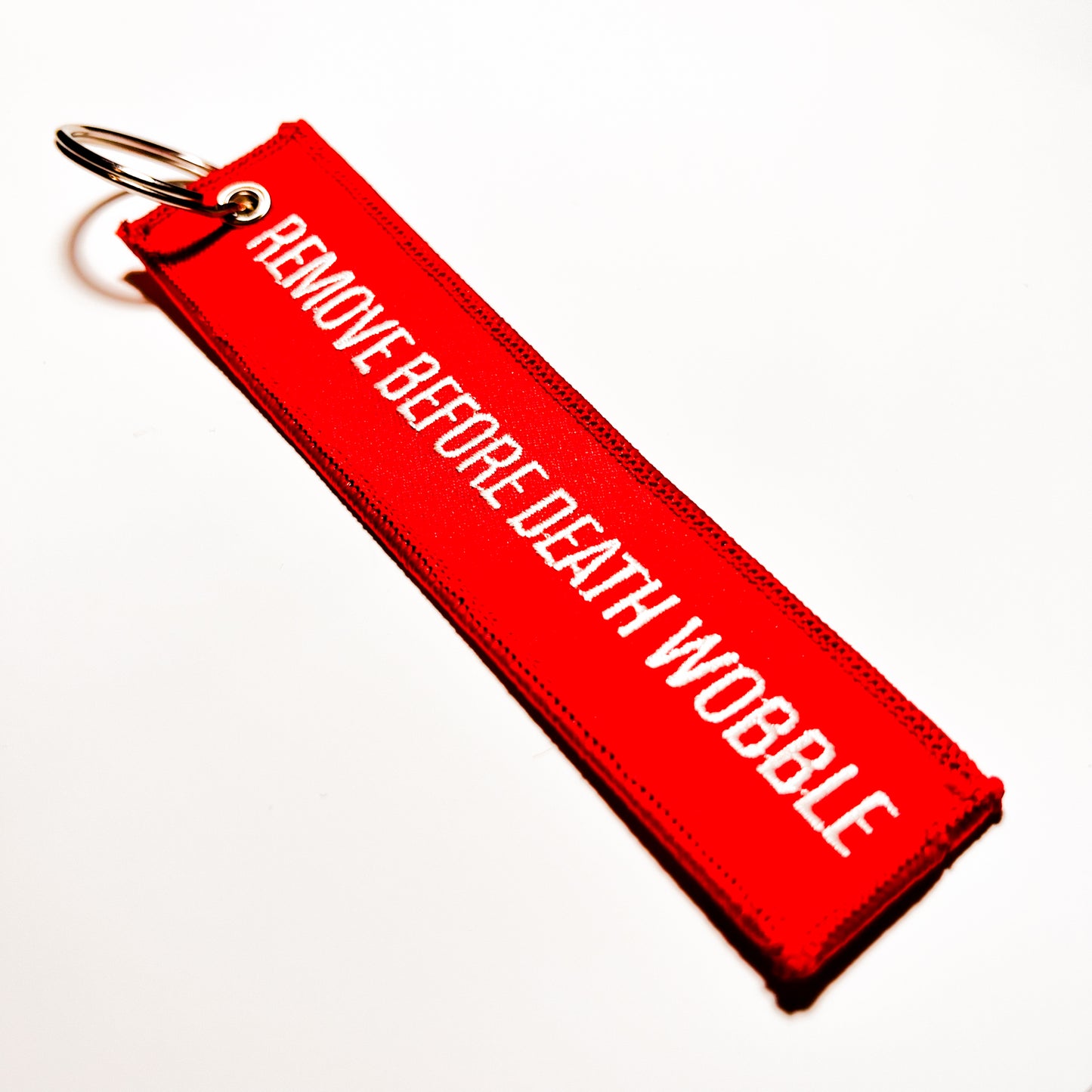 "Remove Before Death Wobble" Flight Tag