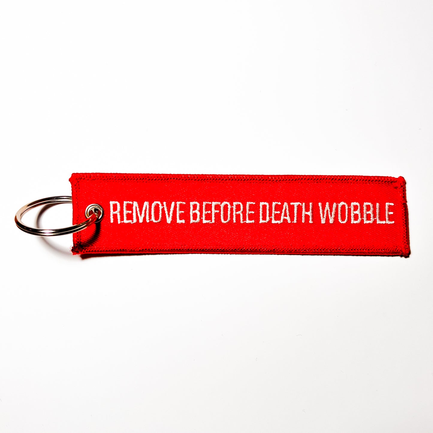 "Remove Before Death Wobble" Flight Tag